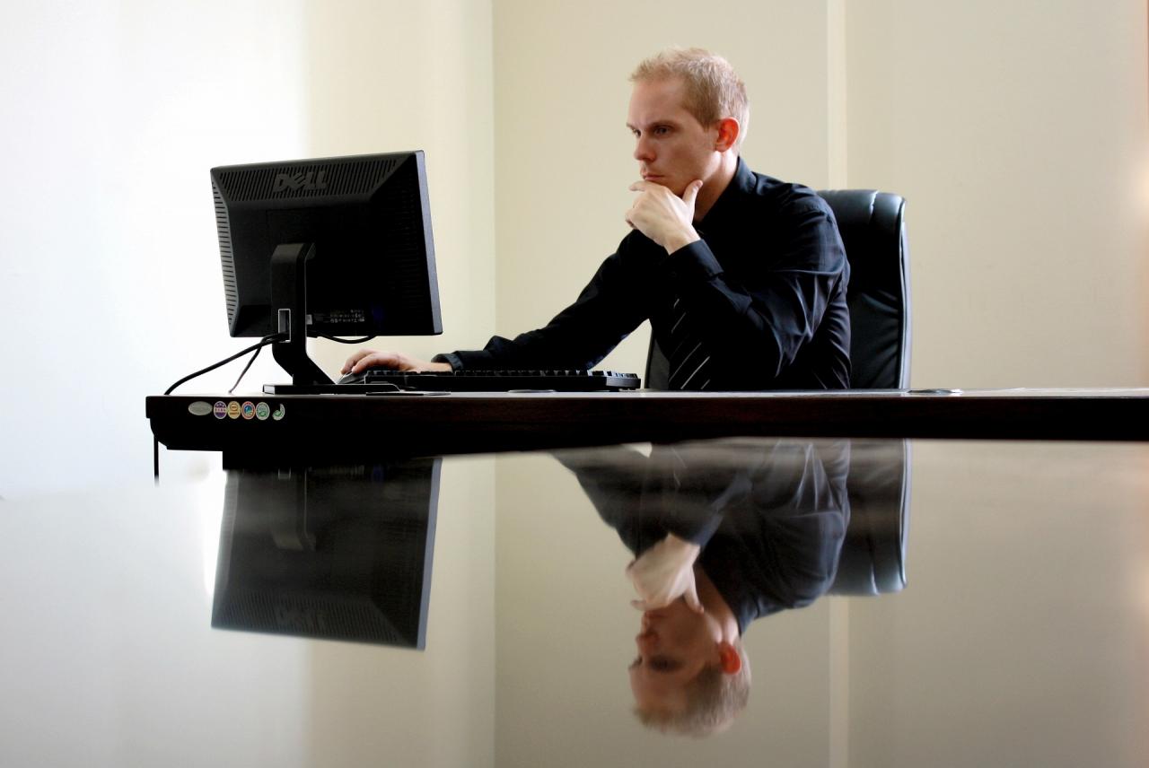 man looking at computer