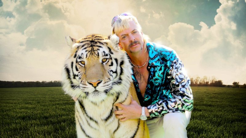 man holding a tiger