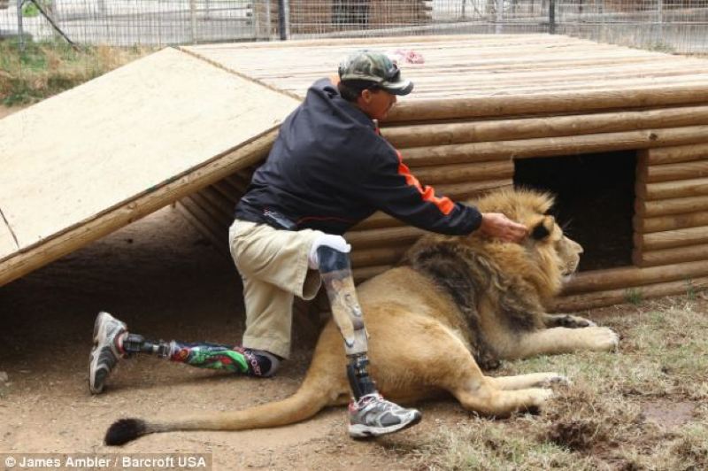 man holding lions mane